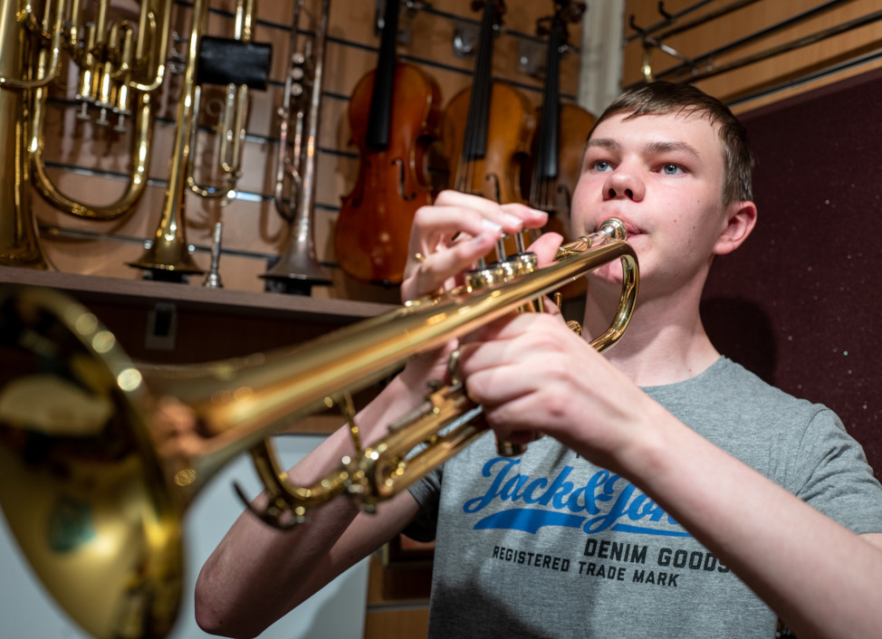 Brass lessons at booths, student having trumpet lessons.
