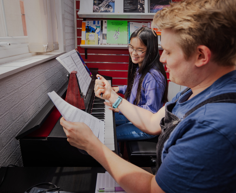 About Us - Music Lessons, Tom with Student